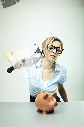 Image of breaking a piggy bank