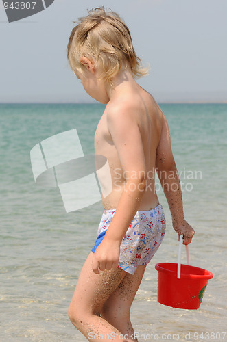 Image of child with bucket