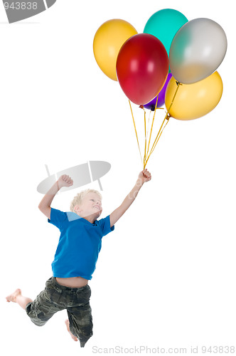 Image of Boy Flying Behind Balloons