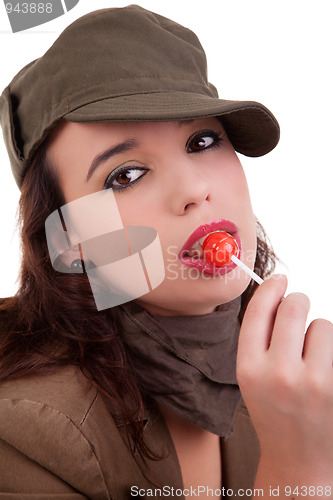 Image of beautiful young woman with a lollipop 