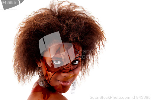 Image of beautiful black woman, with autumn leaves painted on face