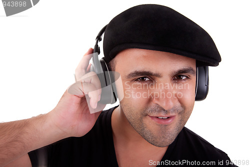 Image of man listening music in headphones and smiling