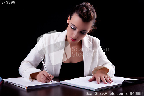 Image of pretty woman in desk with papers