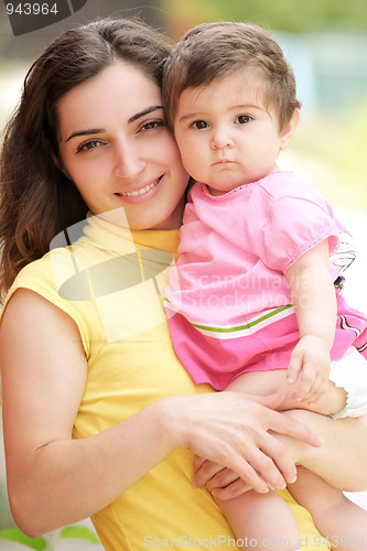 Image of Mother with little daughter closeup