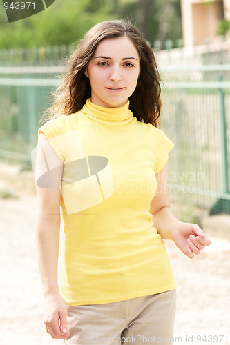 Image of Young woman in yellow