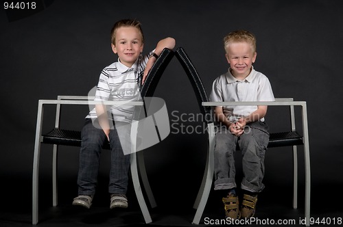 Image of Two Brothers On A Chair