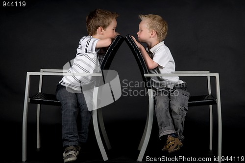 Image of Two Brothers On A Chair