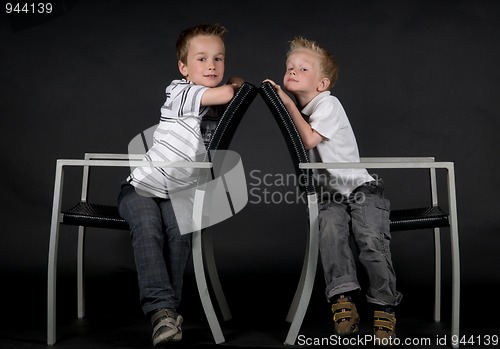 Image of Two Brothers On A Chair