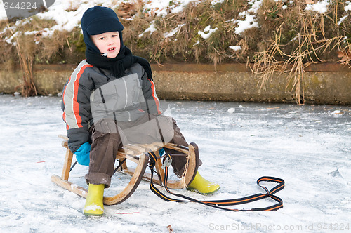 Image of Boy On A Sleigh