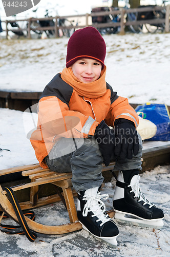 Image of Little boy on a sled