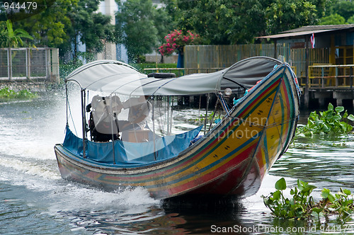 Image of Longtail boat on a canal in Bangkok, Thailand