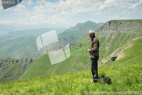 Image of Man praying in mountains