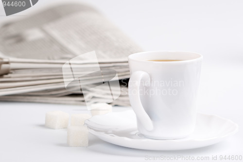 Image of coffee, sugar and newspapers