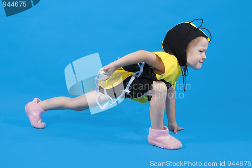 Image of Small girl is dressed at bee costume