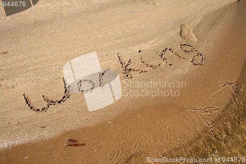 Image of Text on the sand