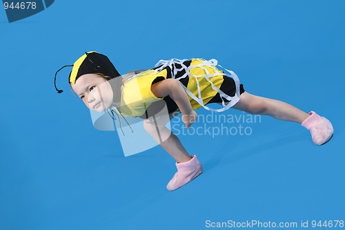 Image of Small girl is dressed at bee costume