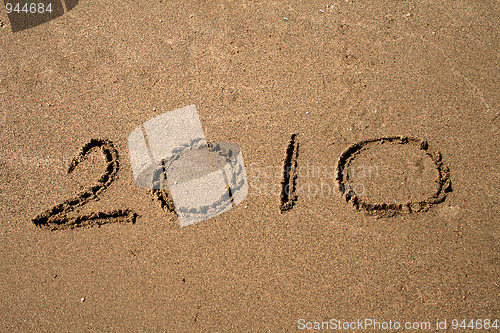 Image of Text on the sand