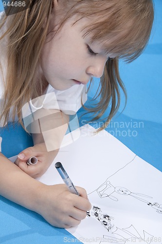 Image of Small cute girl is sketching