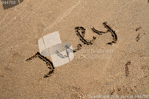 Image of Text on the sand