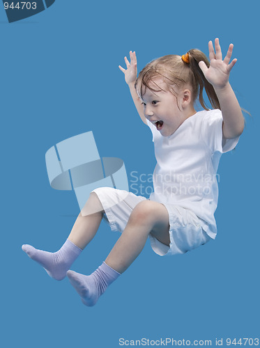 Image of Small happiness girl is jumping
