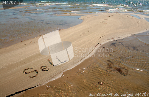 Image of Text on the sand