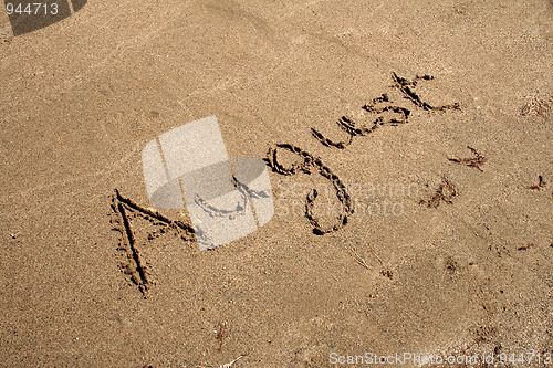 Image of Text on the sand