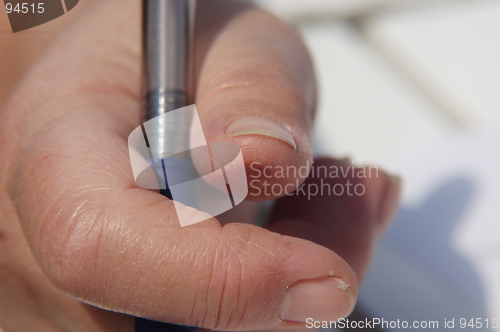 Image of Fingers with pencil