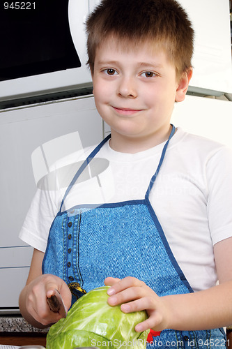 Image of Smiling boy with cabbage