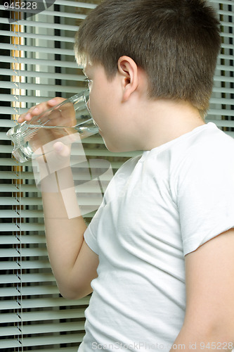 Image of Boy in white drinking water