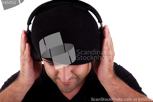 Image of man with hat listening music in headphones
