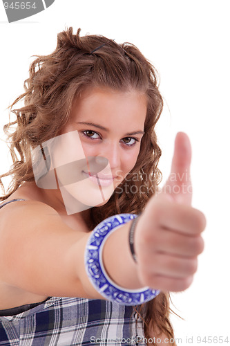 Image of pretty girl with thumb raised as a sign of success