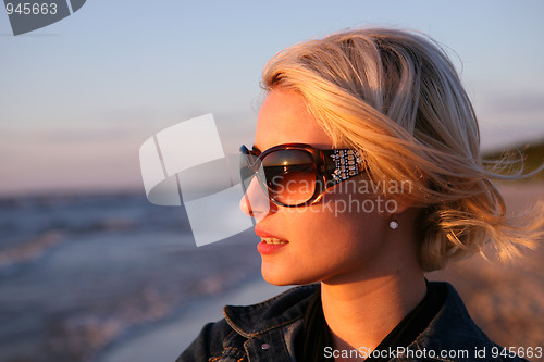 Image of Young woman  look on sunset