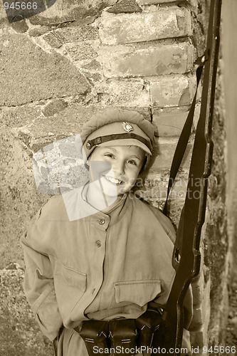 Image of boy in a street clothes 2-nd World War