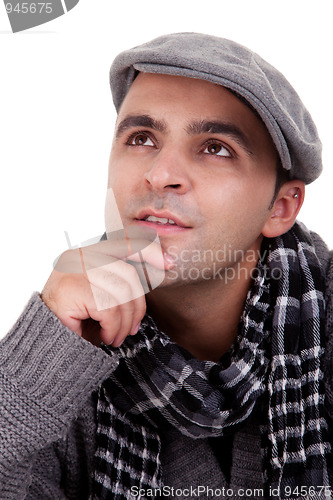 Image of Portrait of a young man thinking, in autumn/winter clothes