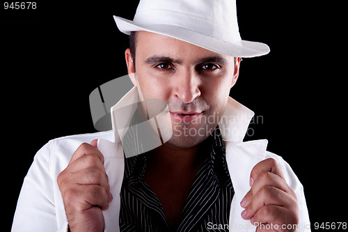 Image of Portrait of a man with his white hat and coat