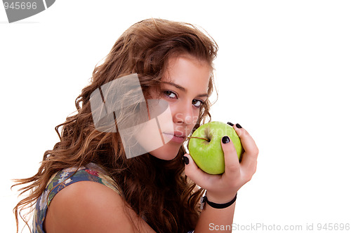 Image of Beautiful girl eating a green apple