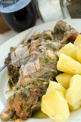 Image of greek taverna food lamb in the paper