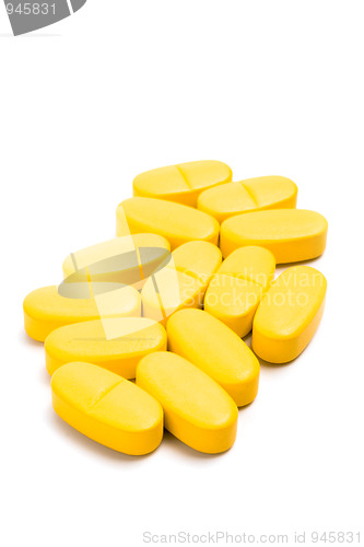 Image of yellow vitamin pills