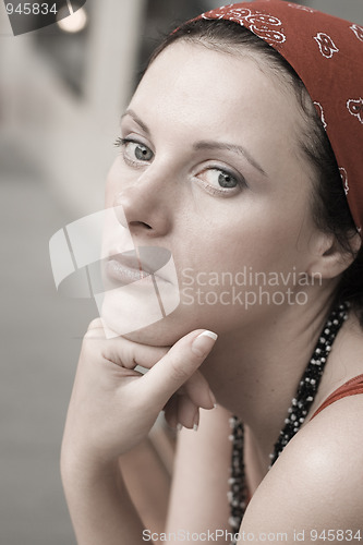 Image of unhappy woman in red kerchief