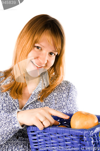 Image of woman with a basket full of apples