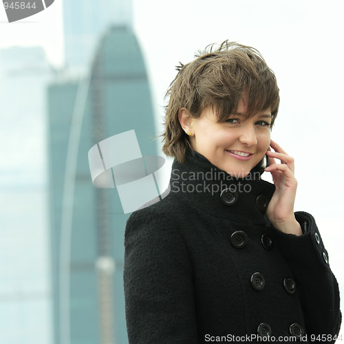 Image of Smiling woman with phone