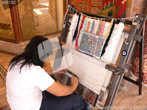 Image of Weaving an carpet. 