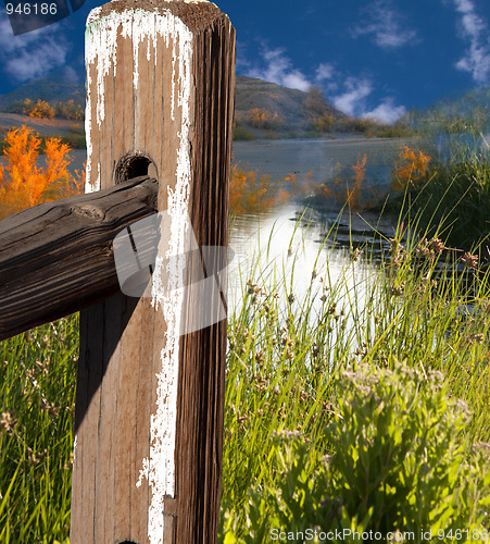 Image of landscape with fence pole