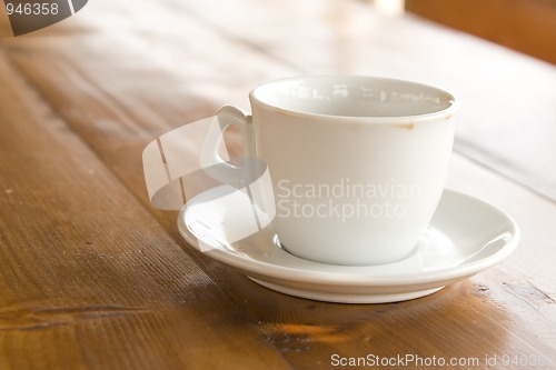 Image of coffee cup on wooden table