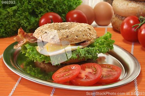Image of Bagel with fried egg and bacon