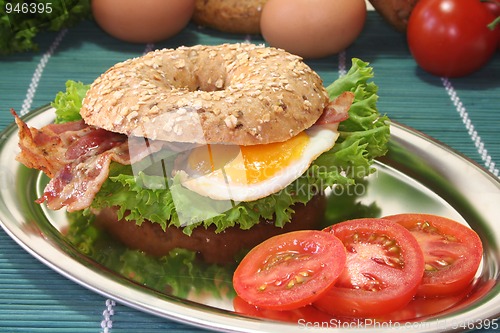 Image of Bagel with fried egg and bacon