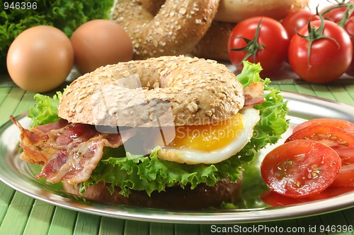 Image of Bagel with fried egg and bacon