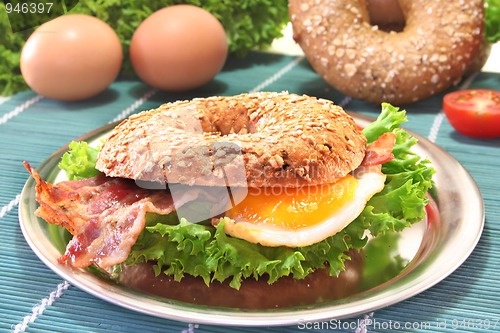 Image of Bagel with fried egg and bacon