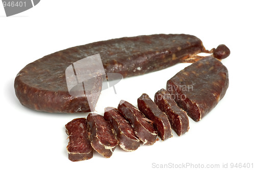 Image of Piece of turkic summer sausage (Sucuk)  and few slices