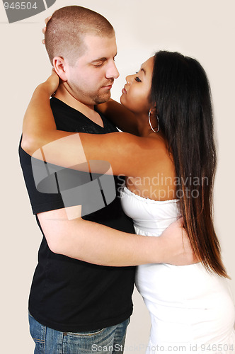 Image of Young couple hugging.
